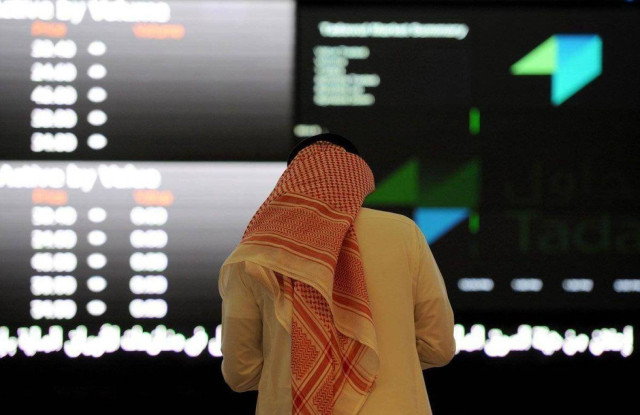 Man monitors the movement of stocks on the Saudi Tadawul index